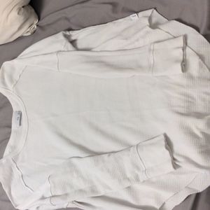 TNA waffle knit top with rounded edge bottom size med